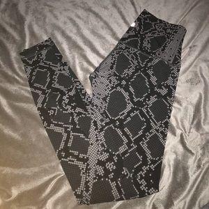 Lulu Lemon grey and black snake print leggings.